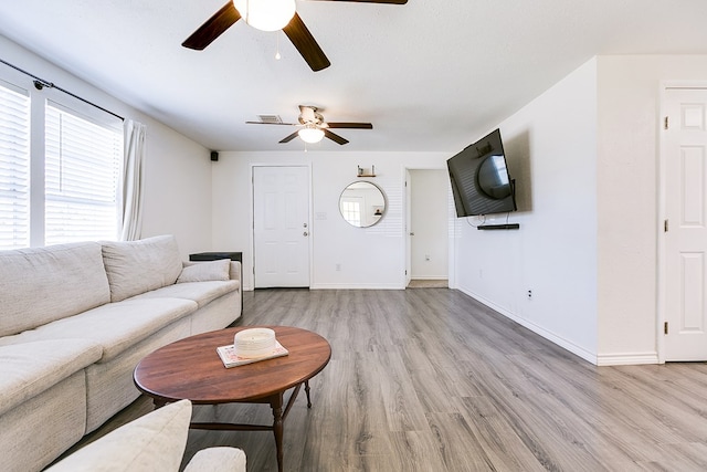 unfurnished living room with light hardwood / wood-style floors and ceiling fan