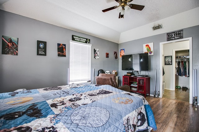 3118 Grandview Dr, San Angelo, TX 76904 - bedroom featuring wood finished floors, a textured ceiling, and a ceiling fan
