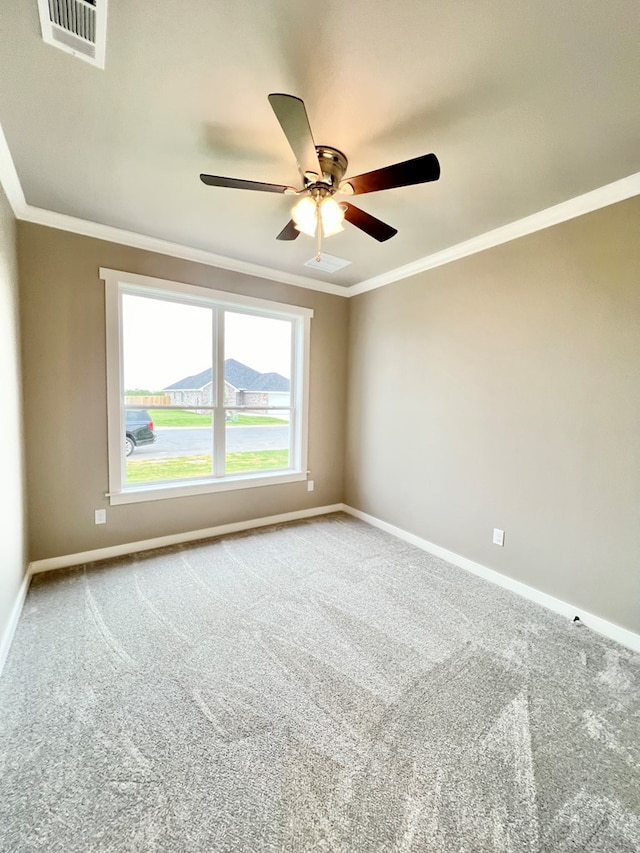 3962 Ruth Ln, San Angelo, TX 76904 - carpeted empty room with crown molding, a ceiling fan, and baseboards
