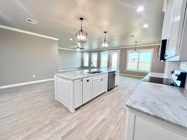 3962 Ruth Ln, San Angelo, TX 76904 - kitchen featuring stainless steel appliances, ornamental molding, a sink, baseboards, and light wood-style flooring