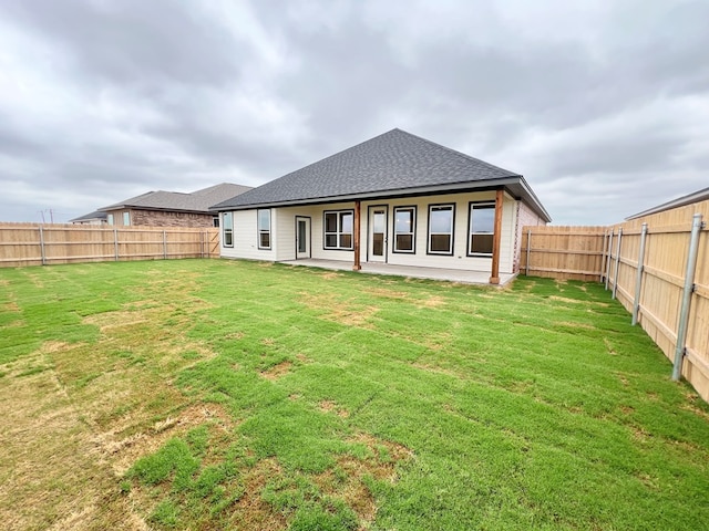 3962 Ruth Ln, San Angelo, TX 76904 - back of house featuring a shingled roof and a patio
