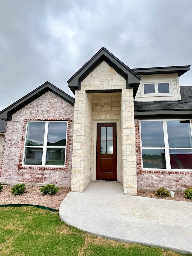 3962 Ruth Ln, San Angelo, TX 76904 - view of exterior entry featuring stone siding and brick siding