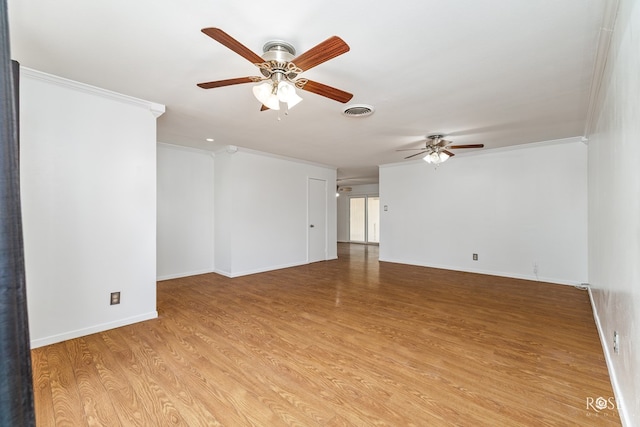 unfurnished room featuring baseboards, light wood finished floors, visible vents, and ceiling fan