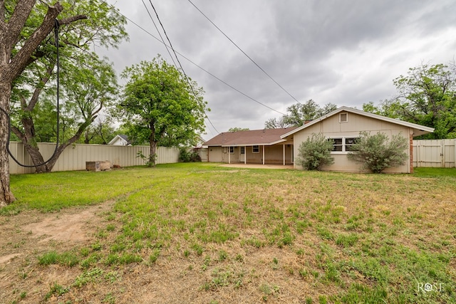 view of yard with a patio and a fenced backyard