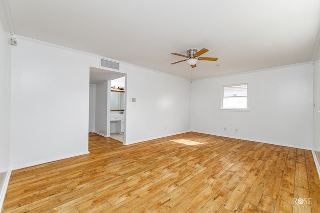 unfurnished room with ceiling fan, ornamental molding, and visible vents