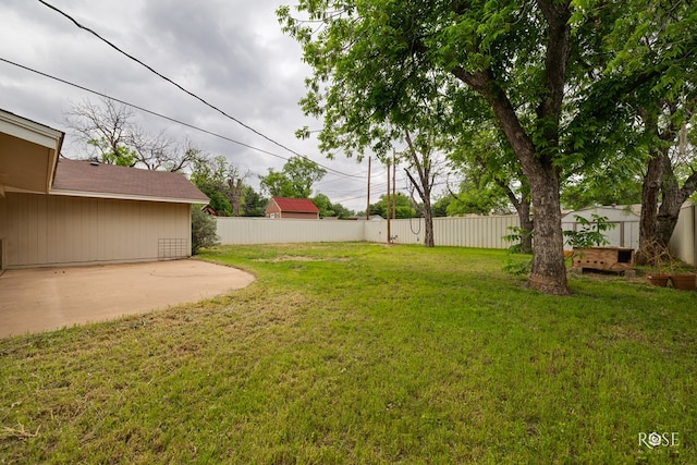 view of yard with a patio area and fence