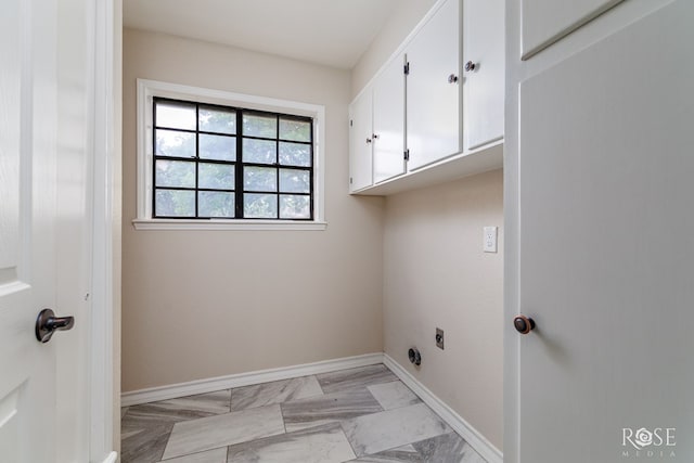 washroom with electric dryer hookup, marble finish floor, cabinet space, and baseboards
