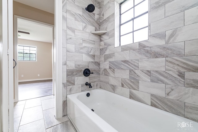 bathroom with baseboards and bathing tub / shower combination