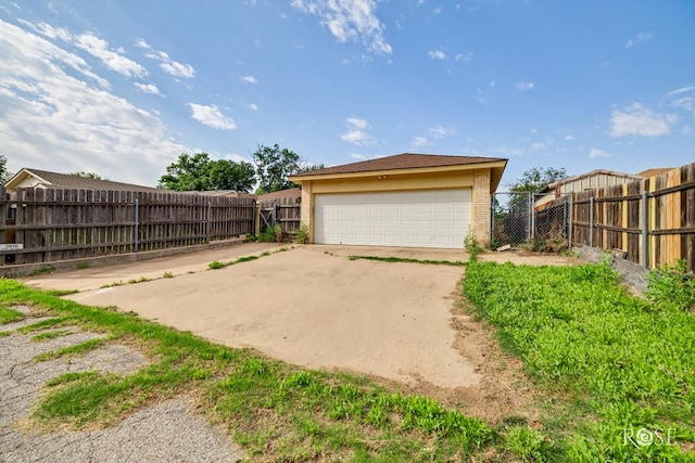 detached garage featuring fence