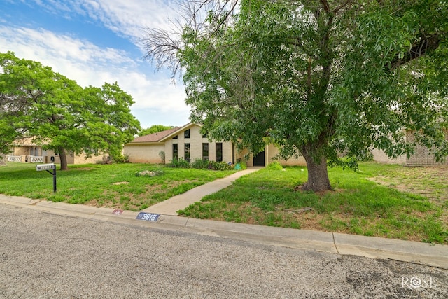 view of front of home with a front lawn