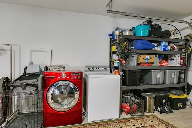 clothes washing area with a garage, laundry area, and independent washer and dryer