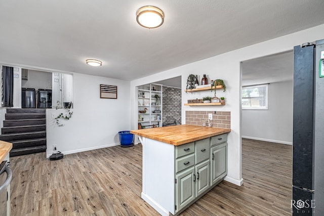 2113 Sul Ross St, San Angelo, TX 76904 - kitchen featuring butcher block counters, wood finished floors, and open shelves