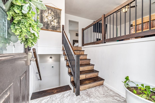 2113 Sul Ross St, San Angelo, TX 76904 - stairway with marble look tile flooring and baseboards
