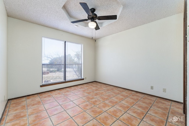 unfurnished room with a textured ceiling and a ceiling fan