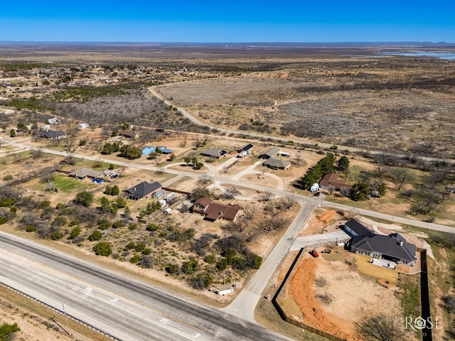 drone / aerial view with view of desert