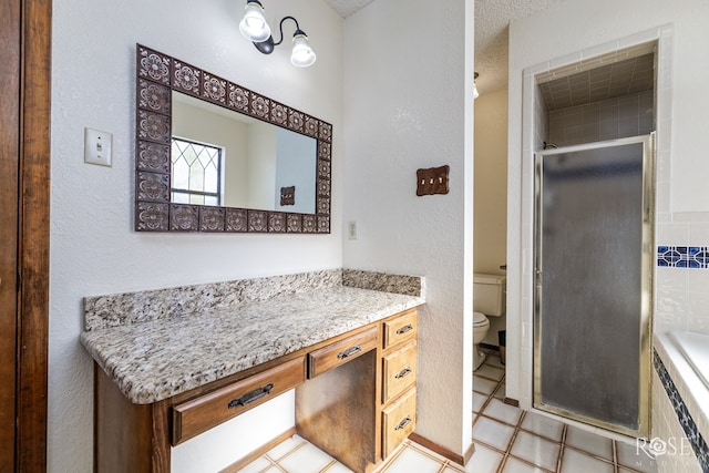 full bathroom featuring toilet, a stall shower, a bath, and vanity