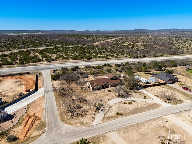 drone / aerial view featuring a mountain view