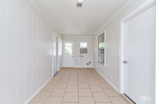 2109 Dartmouth Dr, San Angelo, TX 76904 - spare room featuring ornamental molding, light tile patterned flooring, a decorative wall, and cooling unit