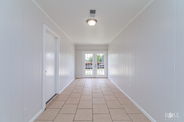 2109 Dartmouth Dr, San Angelo, TX 76904 - empty room featuring ornamental molding, french doors, light tile patterned floors, and baseboards