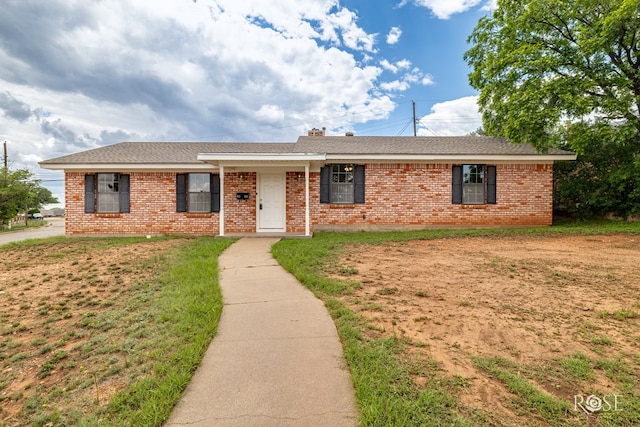 2109 Dartmouth Dr, San Angelo, TX 76904 - single story home featuring brick siding, a front yard, and a shingled roof