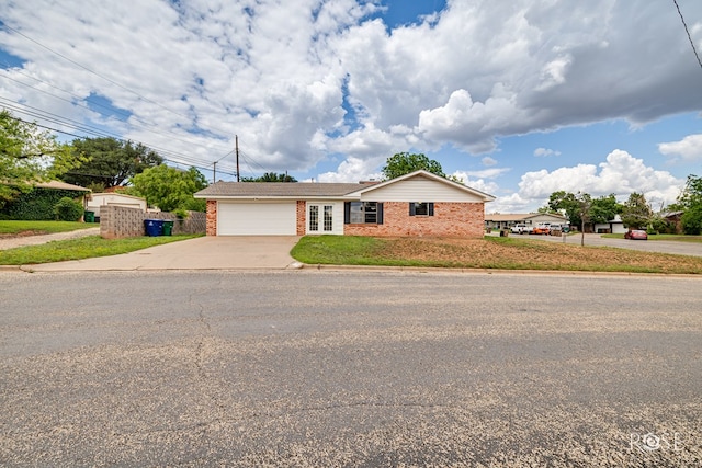 2109 Dartmouth Dr, San Angelo, TX 76904 - ranch-style house featuring brick siding, concrete driveway, and an attached garage