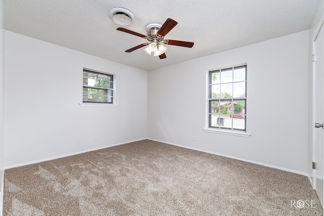2109 Dartmouth Dr, San Angelo, TX 76904 - unfurnished room with carpet floors, plenty of natural light, ceiling fan, and a textured ceiling