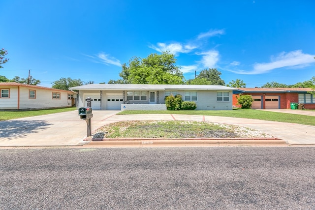 2650 Rice Ave, San Angelo, TX 76904 - ranch-style house featuring driveway, an attached garage, and a front lawn
