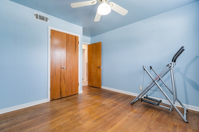 2650 Rice Ave, San Angelo, TX 76904 - exercise room with baseboards, wood finished floors, and a ceiling fan