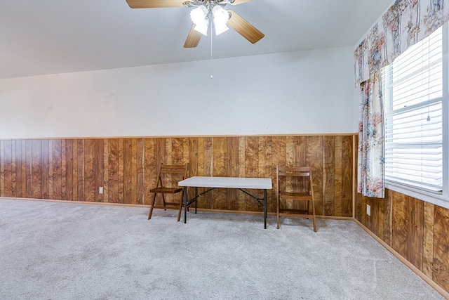 2650 Rice Ave, San Angelo, TX 76904 - sitting room with wooden walls, carpet, ceiling fan, and a wainscoted wall