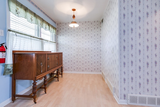 2650 Rice Ave, San Angelo, TX 76904 - living area with wood finished floors, wallpapered walls, and baseboards
