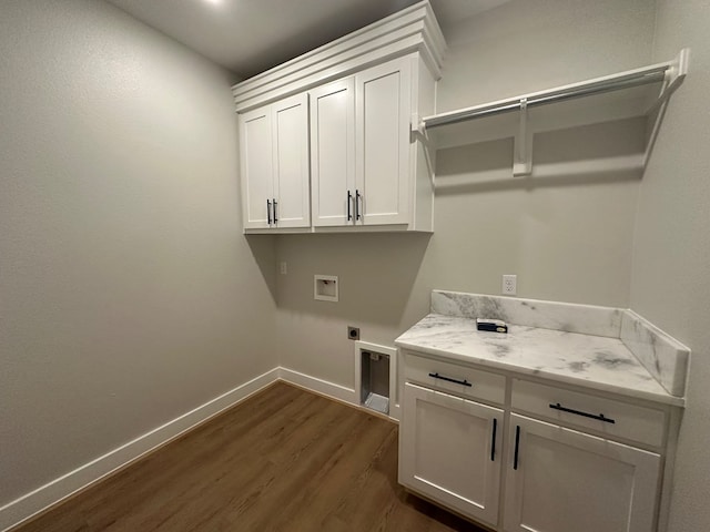 3609 Clearview Dr, San Angelo, TX 76904 - washroom with cabinet space, electric dryer hookup, dark wood-style floors, hookup for a washing machine, and baseboards