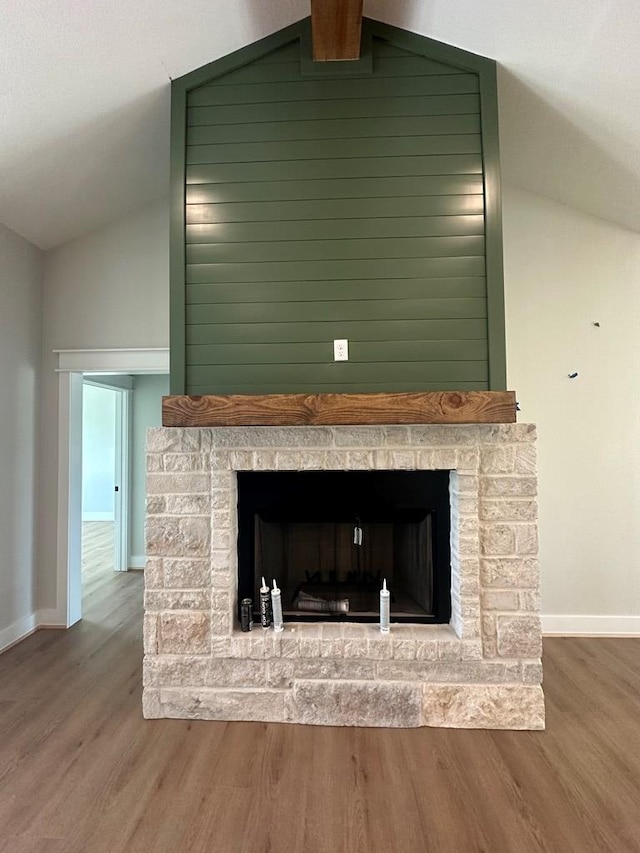 3609 Clearview Dr, San Angelo, TX 76904 - detailed view of a fireplace with raised hearth, wood finished floors, and baseboards
