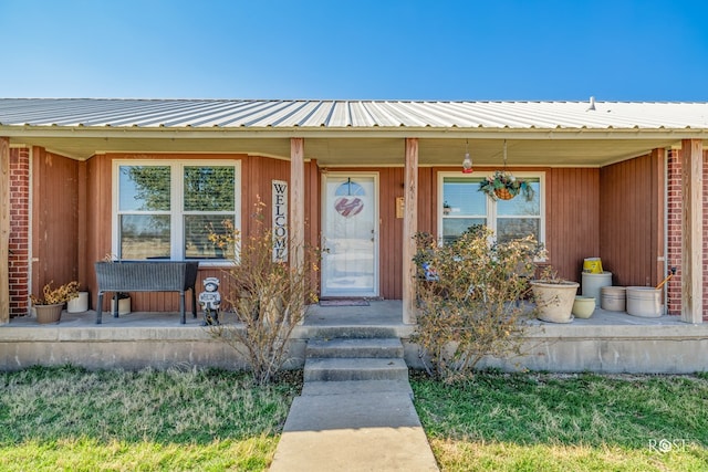 doorway to property featuring covered porch