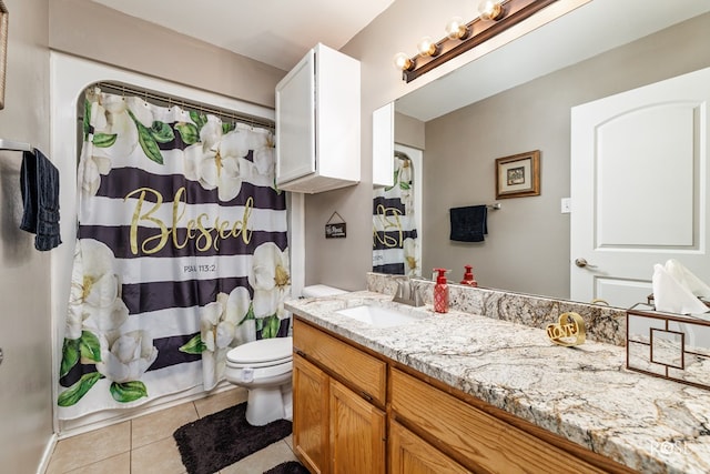 bathroom featuring tile patterned flooring, vanity, a shower with curtain, and toilet