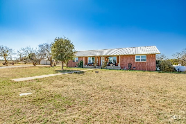 ranch-style house with a porch and a front yard