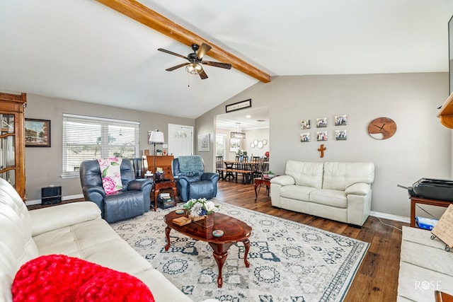 living room with lofted ceiling with beams, dark hardwood / wood-style floors, and ceiling fan