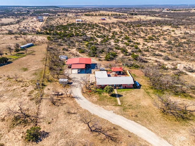 birds eye view of property with a rural view