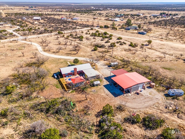 birds eye view of property with a rural view