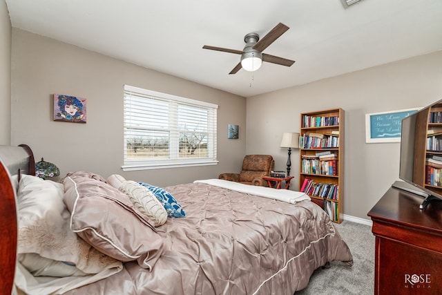 bedroom featuring light colored carpet and ceiling fan