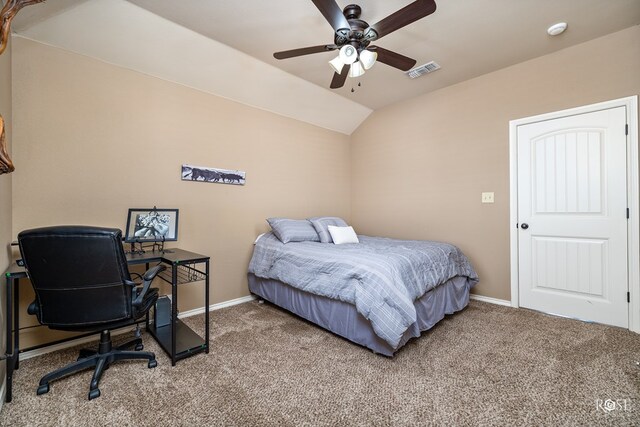 carpeted bedroom featuring vaulted ceiling, ceiling fan, visible vents, and baseboards