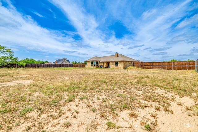 view of yard with a fenced backyard