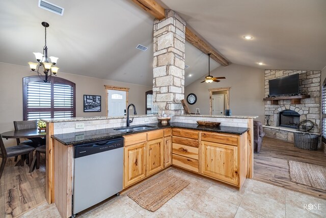 kitchen featuring open floor plan, dishwashing machine, a sink, and visible vents