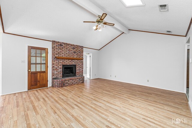 5821 Davenport Dr, San Angelo, TX 76901 - unfurnished living room featuring wood finished floors, ceiling fan, and a brick fireplace