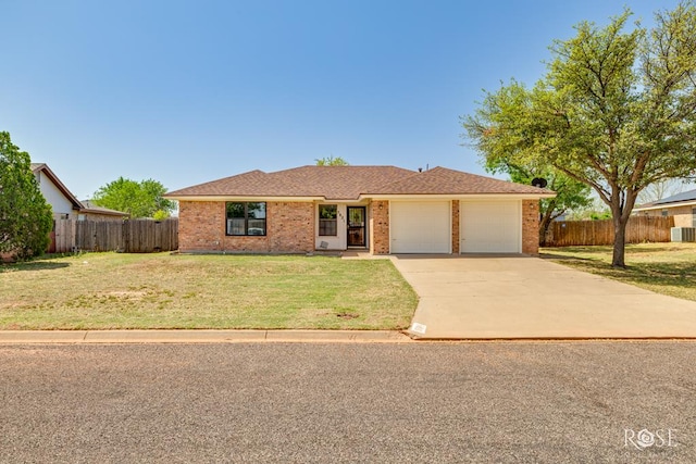 5821 Davenport Dr, San Angelo, TX 76901 - single story home with a garage, brick siding, and driveway