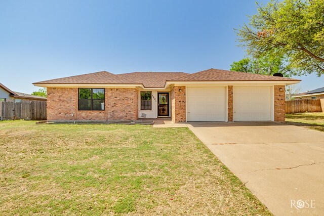 5821 Davenport Dr, San Angelo, TX 76901 - ranch-style house with a garage, brick siding, and concrete driveway