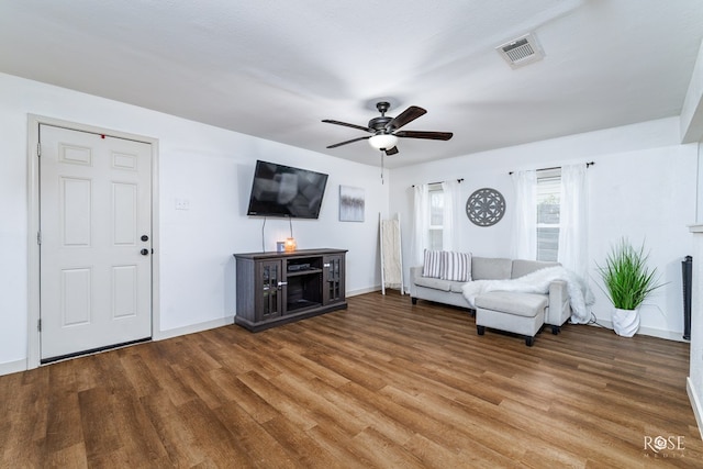 unfurnished living room with hardwood / wood-style flooring, a textured ceiling, and ceiling fan