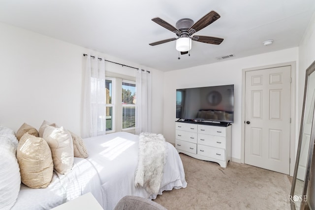 carpeted bedroom with ceiling fan