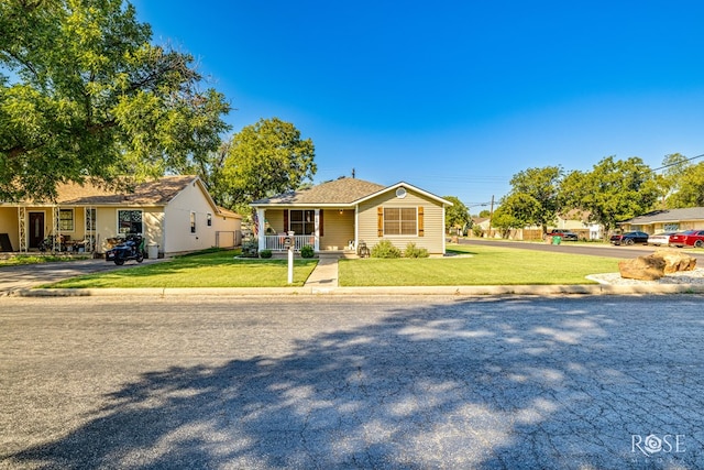 view of front of property with a front yard and a porch