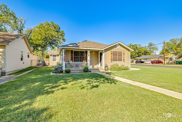 view of front of house featuring a porch and a front yard