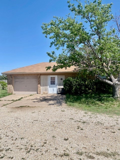 8882 Fm 765, San Angelo, TX 76905 - single story home featuring brick siding, concrete driveway, and a garage